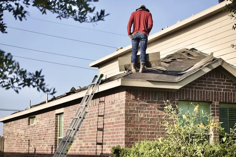 Professional roofer working on a residential roof in Metropolis